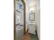 Elegant powder room with custom vanity and decorative mirror at 12 Via Ravello, Henderson, NV 89011