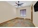 Neutral bedroom with tile flooring, a ceiling fan, and natural light from one window at 12 Via Ravello, Henderson, NV 89011