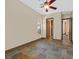 Bedroom with a decorative ceiling fan, beautiful floor tiles, and multiple doorways adds to the room's luxe feel at 12 Via Ravello, Henderson, NV 89011