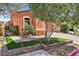 Charming home with a turret, well-manicured lawn, stone accents, and a private, gated courtyard entrance at 12 Via Ravello, Henderson, NV 89011