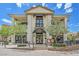 Elegant building with columns, a balcony, and manicured landscaping creating a welcoming atmosphere at 12 Via Ravello, Henderson, NV 89011