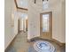 Entry foyer featuring a decorative mosaic inlay, neutral wall paint, and wood trim at 12 Via Ravello, Henderson, NV 89011