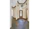 Elegant foyer featuring slate floors, mosaic accents, an ornate door, and decorative lighting fixtures above at 12 Via Ravello, Henderson, NV 89011