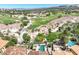 A lush golf course meanders through a desert landscape, complementing a home's private pool and spa at 12 Via Ravello, Henderson, NV 89011