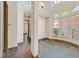 Hallway showcasing tile flooring, neutral walls, and views of the surrounding rooms at 12 Via Ravello, Henderson, NV 89011