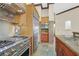 Well-appointed kitchen with stainless steel appliances, custom tile work, and ample counter space at 12 Via Ravello, Henderson, NV 89011