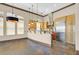 Gourmet kitchen features stainless steel appliances, granite countertops, and custom cabinetry at 12 Via Ravello, Henderson, NV 89011