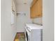 Efficient laundry room equipped with modern washer and dryer, plus built in cabinets for optimal storage space at 12 Via Ravello, Henderson, NV 89011