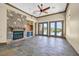 Spacious living room features a stone fireplace, built-in shelving, and French doors leading to the outdoor area at 12 Via Ravello, Henderson, NV 89011