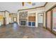 Spacious living area with stone fireplace, custom built-ins, and access to multiple rooms at 12 Via Ravello, Henderson, NV 89011