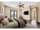 Virtually staged main bedroom featuring access to a private outdoor terrace and decorative stone flooring at 12 Via Ravello, Henderson, NV 89011