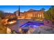 Inviting pool and spa with a cozy fire pit and lush landscaping for the ultimate relaxation at 12 Via Ravello, Henderson, NV 89011