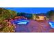 Relaxing backyard spa with rock waterfall feature, and lush landscaping, perfect for enjoying your time outside at 12 Via Ravello, Henderson, NV 89011