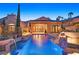 Backyard pool featuring waterfalls, beautiful landscaping, and an inviting outdoor living space at 12 Via Ravello, Henderson, NV 89011