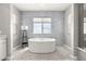 Bathroom with standalone tub, mosaic tile wall and flooring at 12024 Girasole Ave, Las Vegas, NV 89138