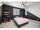 Bedroom with a unique two-tone accent wall and a ceiling fan at 12024 Girasole Ave, Las Vegas, NV 89138