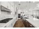 Gourmet kitchen boasts a large island, stainless steel appliances, and stylish herringbone backsplash at 12024 Girasole Ave, Las Vegas, NV 89138