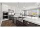 Modern kitchen with a center island, stainless steel appliances, and plenty of natural light at 12024 Girasole Ave, Las Vegas, NV 89138