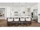 Spacious kitchen features a large center island, stainless steel appliances, and modern pendant lighting at 12024 Girasole Ave, Las Vegas, NV 89138