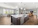 Open kitchen featuring a stainless steel dishwasher set in wood cabinetry island, with an open floor plan at 12024 Girasole Ave, Las Vegas, NV 89138