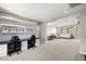 Spacious living area with custom desks, ample natural light, and open space for entertaining or relaxing at 12024 Girasole Ave, Las Vegas, NV 89138