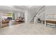 Spacious living area with tile and hardwood flooring, open floor plan, and inviting seating arrangement at 12024 Girasole Ave, Las Vegas, NV 89138