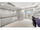 Upstairs loft with natural light, desk space, and versatile living area. Stairs and railings visible at 12024 Girasole Ave, Las Vegas, NV 89138