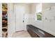 Mudroom with storage bench, hooks, and direct access to a pantry, ideal for organization at 12024 Girasole Ave, Las Vegas, NV 89138
