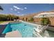 Inviting pool area featuring lounge chairs and an umbrella, perfect for relaxation and enjoying sunny days at 12024 Girasole Ave, Las Vegas, NV 89138