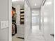 Walk-in closet with a glimpse into bathroom at 12024 Girasole Ave, Las Vegas, NV 89138