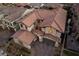 Stunning aerial view of a home with a tile roof and spacious three-car garage at 12125 Edgehurst Ct, Las Vegas, NV 89138