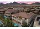 Stunning aerial view of a beautiful home in a neighborhood with mountain views at 12125 Edgehurst Ct, Las Vegas, NV 89138
