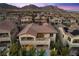 Breathtaking aerial view of a beautiful home with a large balcony overlooking the backyard pool at 12125 Edgehurst Ct, Las Vegas, NV 89138