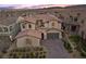 Beautiful aerial view of a house in a well-maintained neighborhood with mountain views at 12125 Edgehurst Ct, Las Vegas, NV 89138