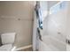 Cozy bathroom featuring a white toilet, a bathtub and a white curtain at 12125 Edgehurst Ct, Las Vegas, NV 89138