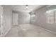 Neutral bedroom featuring a large window, plush carpet, and ample closet space at 12125 Edgehurst Ct, Las Vegas, NV 89138