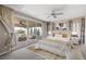 Bedroom featuring a ceiling fan and a sliding glass door to a patio with furniture at 12125 Edgehurst Ct, Las Vegas, NV 89138