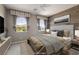 Stylishly furnished bedroom with a wood accent wall and mountain view windows at 12125 Edgehurst Ct, Las Vegas, NV 89138