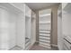 Spacious walk-in closet featuring custom shelving and drawer units at 12125 Edgehurst Ct, Las Vegas, NV 89138