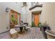 Charming courtyard featuring brick pavers, a seating area, and a decorative sculpture at 12125 Edgehurst Ct, Las Vegas, NV 89138