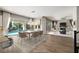 Elegant dining area featuring modern furniture, a chandelier, and views of the backyard pool at 12125 Edgehurst Ct, Las Vegas, NV 89138