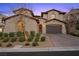 Charming two-story home featuring a paver driveway, stucco exterior, and well-manicured landscaping at 12125 Edgehurst Ct, Las Vegas, NV 89138