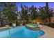 Inviting backyard hot tub featuring lush landscaping and privacy at 12125 Edgehurst Ct, Las Vegas, NV 89138