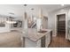 Modern kitchen featuring a granite island, stainless steel appliances, and a walk-in pantry at 12125 Edgehurst Ct, Las Vegas, NV 89138