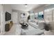 Cozy living room with modern furniture, bright window, and neutral decor at 12125 Edgehurst Ct, Las Vegas, NV 89138