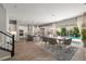 Virtually staged open floor plan features a chef's kitchen, living area, staircase and doors to the pool at 12125 Edgehurst Ct, Las Vegas, NV 89138