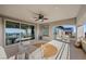 Charming covered patio featuring ample seating and scenic views through sliding glass doors at 12125 Edgehurst Ct, Las Vegas, NV 89138