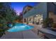 Gorgeous backyard pool and patio area with lounge chairs and outdoor seating at 12125 Edgehurst Ct, Las Vegas, NV 89138