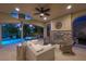 Outdoor patio featuring a sparkling pool and lush trees creating a serene oasis for relaxing and entertaining in style at 12125 Edgehurst Ct, Las Vegas, NV 89138