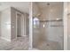 Modern bathroom featuring a glass enclosed shower with sleek tile work at 12125 Edgehurst Ct, Las Vegas, NV 89138